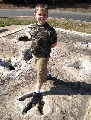 Hayden and dino footprint